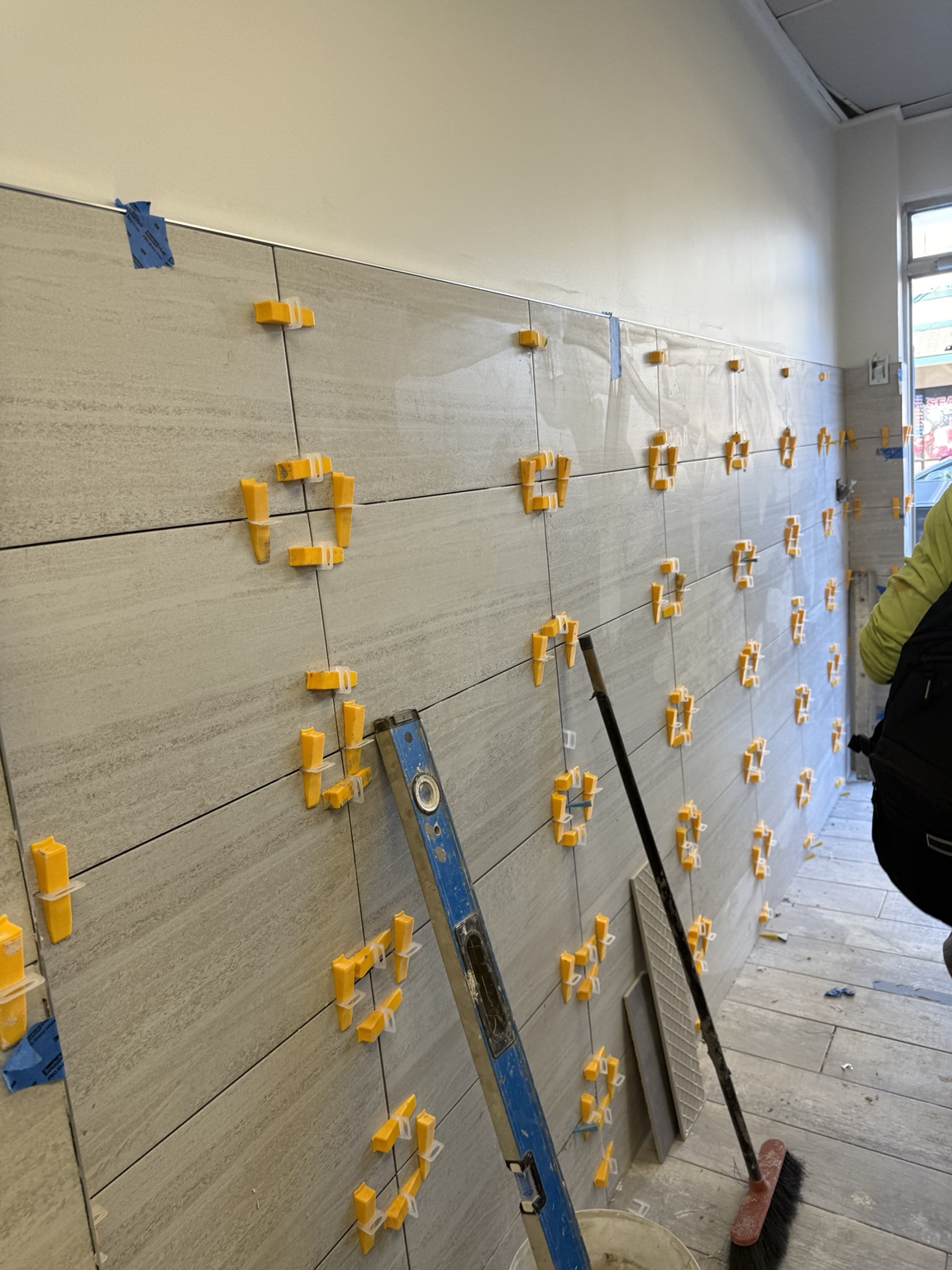 Professional tile installation in progress